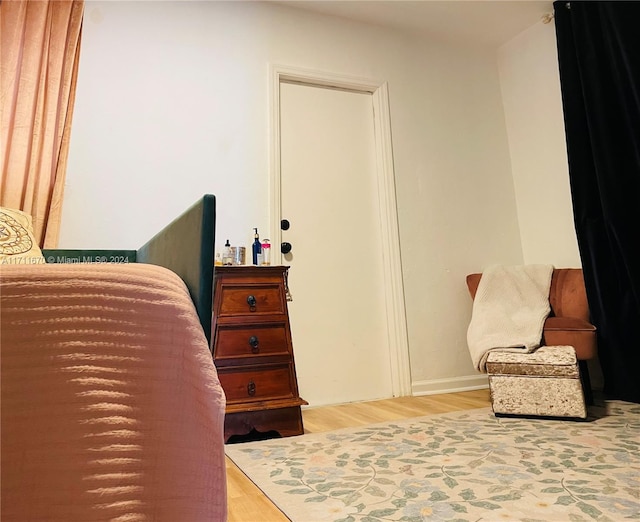 bedroom with wood-type flooring