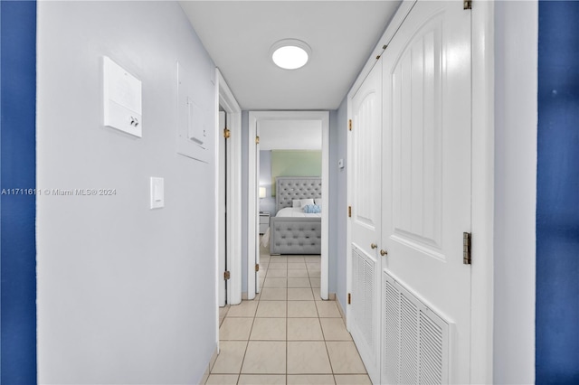 hallway featuring light tile patterned flooring