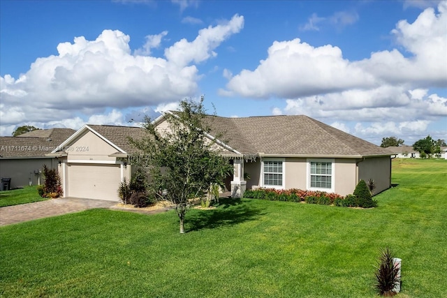 ranch-style house featuring a front yard and a garage