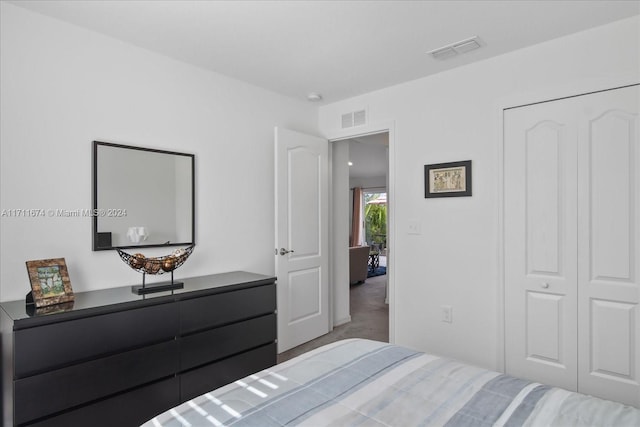 bedroom with carpet floors and a closet