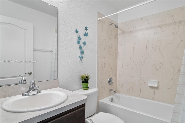 full bathroom with vanity, toilet, and tiled shower / bath