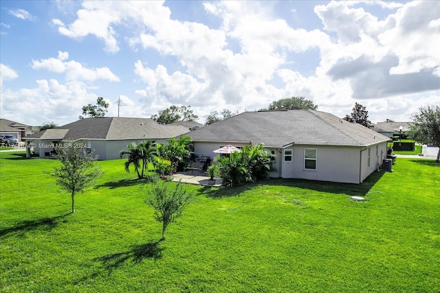 back of house with a yard