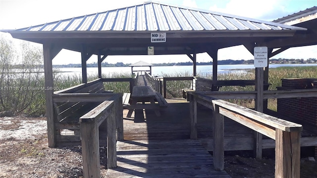 dock area featuring a gazebo and a water view