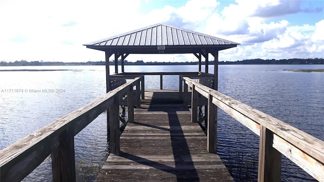 dock area featuring a gazebo and a water view