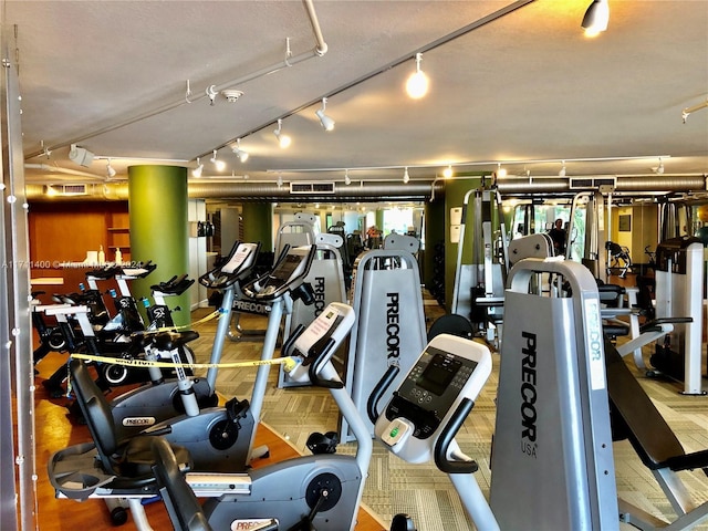 exercise room with track lighting