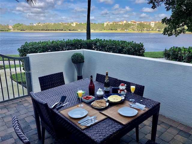 view of patio featuring a water view