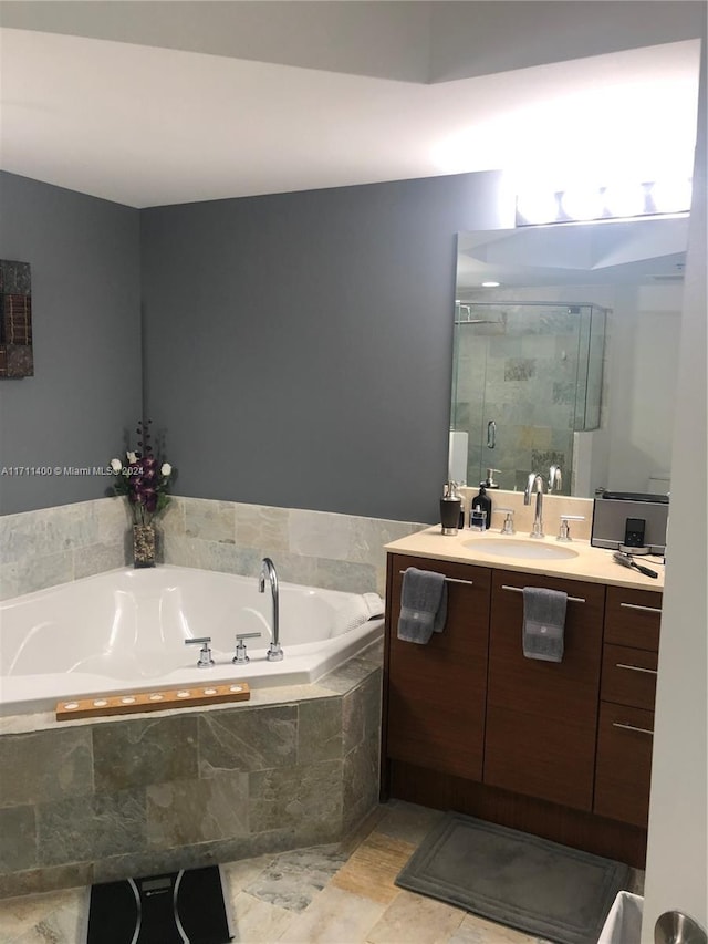 bathroom featuring plus walk in shower and vanity