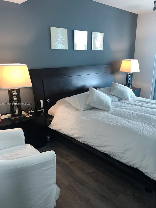 bedroom featuring dark hardwood / wood-style floors