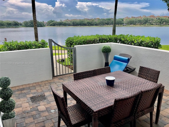 view of patio / terrace featuring a water view