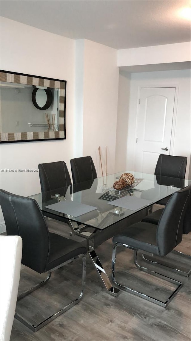 dining area featuring hardwood / wood-style flooring