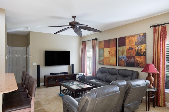 tiled living room with ceiling fan