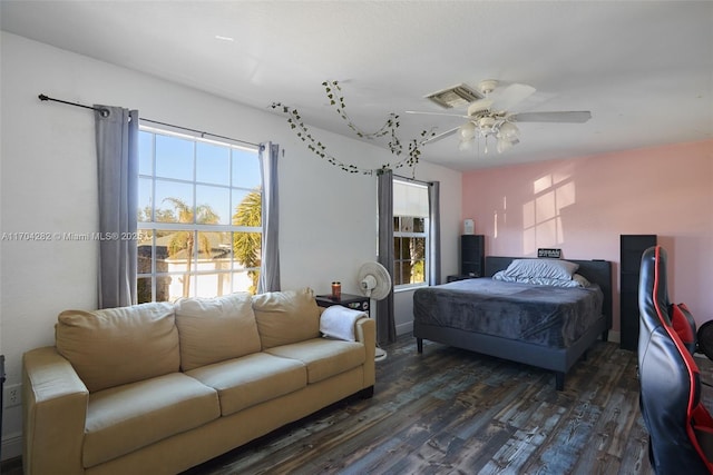 bedroom featuring dark wood-type flooring and ceiling fan