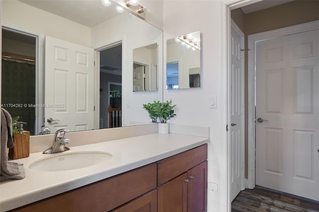 bathroom with vanity and hardwood / wood-style floors