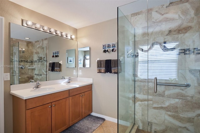 bathroom with vanity, tile patterned floors, and a shower with shower door