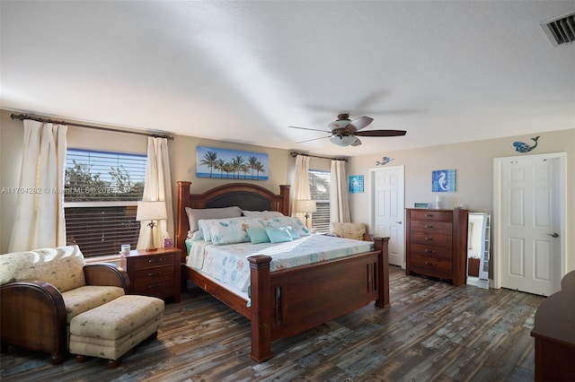 bedroom featuring dark hardwood / wood-style floors and ceiling fan