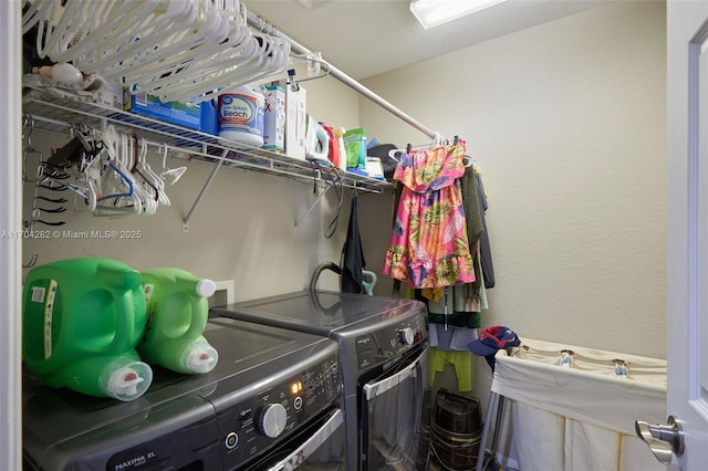 laundry area featuring washing machine and clothes dryer