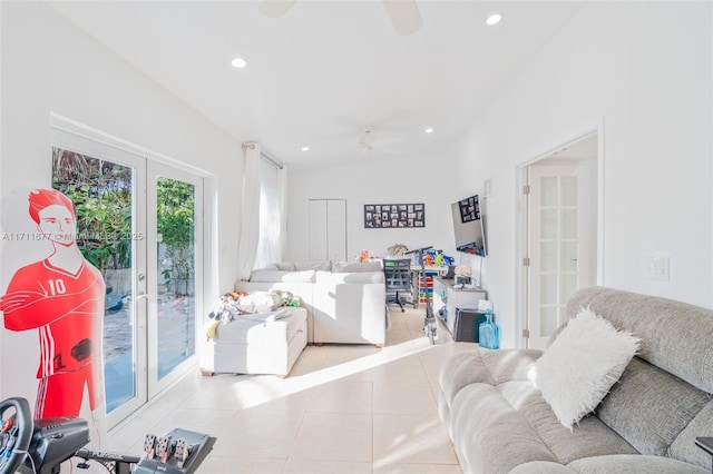 tiled living room with ceiling fan and french doors