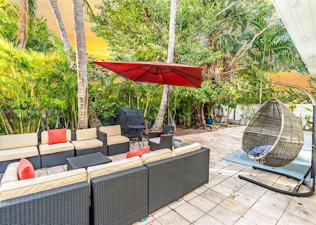 view of patio featuring outdoor lounge area and a grill