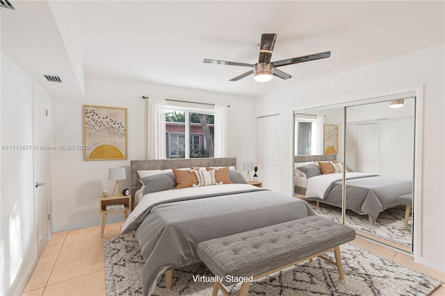 bedroom with ceiling fan and light tile patterned flooring