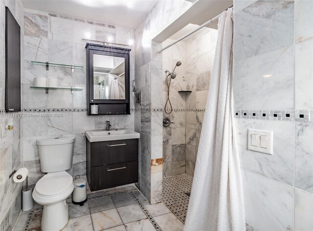 bathroom with a shower with door and plenty of natural light