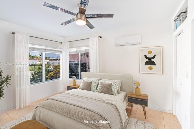 tiled bedroom with a wall mounted air conditioner and ceiling fan