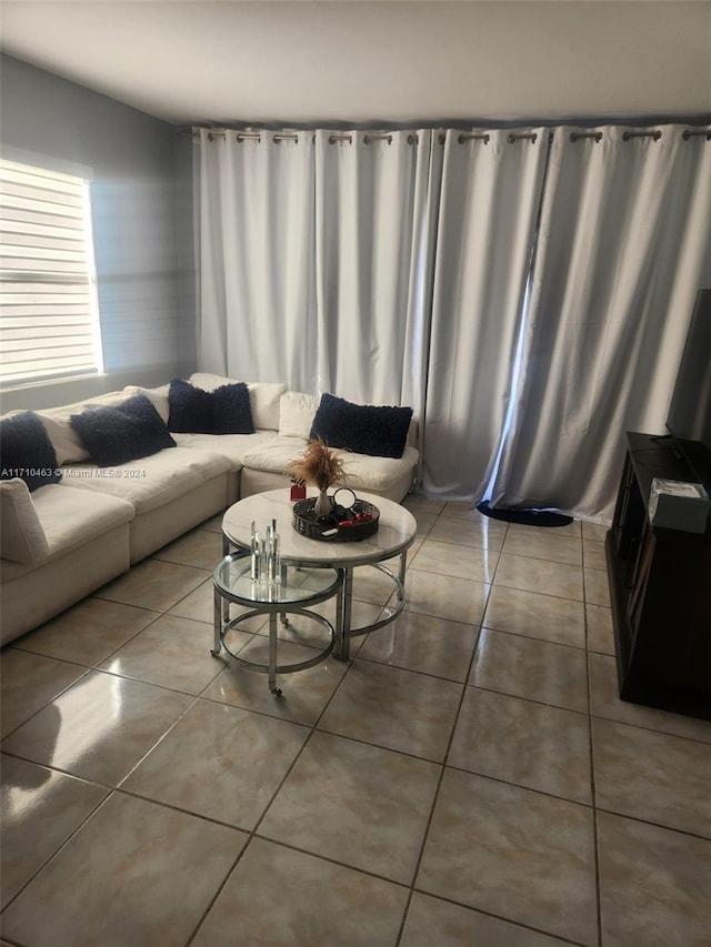 living room with tile patterned flooring