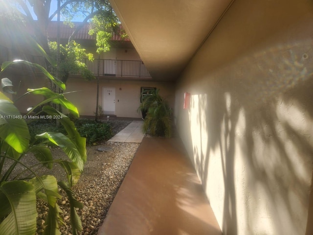 entrance to property with a balcony