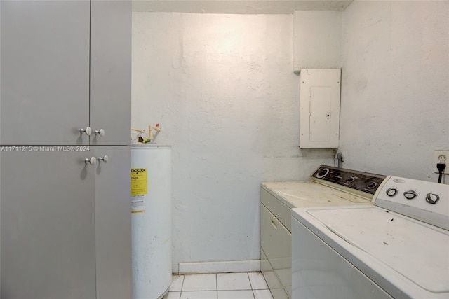 laundry area with cabinets, washing machine and dryer, electric panel, and water heater