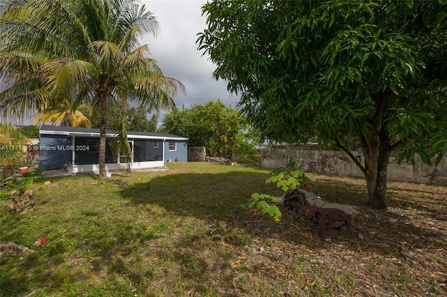 view of yard with a sunroom