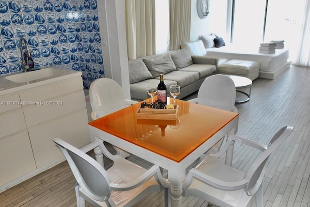 dining room featuring light hardwood / wood-style floors and sink