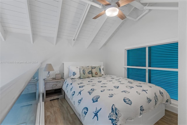 bedroom featuring lofted ceiling with beams, ceiling fan, and light wood-type flooring