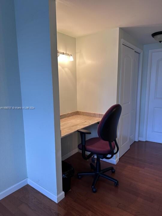 office space with dark hardwood / wood-style floors