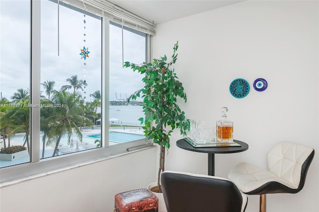 living area featuring a water view