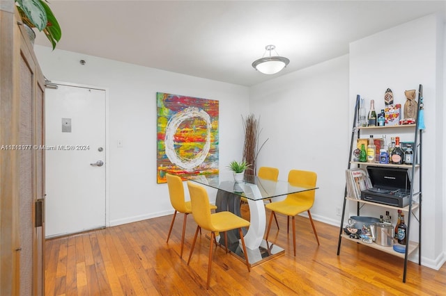 dining area with wood-type flooring