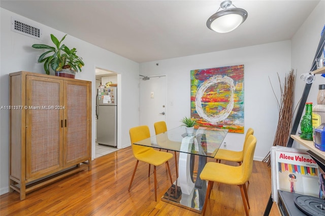 dining space with light wood-type flooring