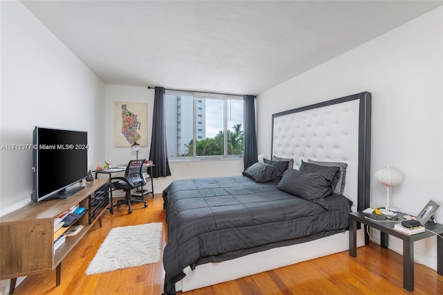 bedroom featuring hardwood / wood-style floors