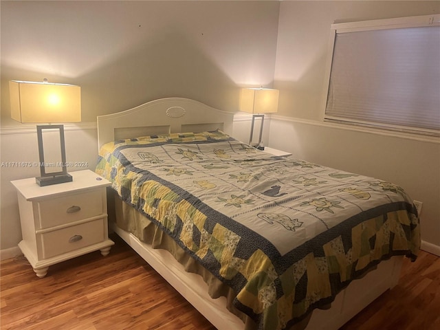 bedroom featuring wood-type flooring