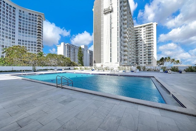 view of swimming pool featuring a patio