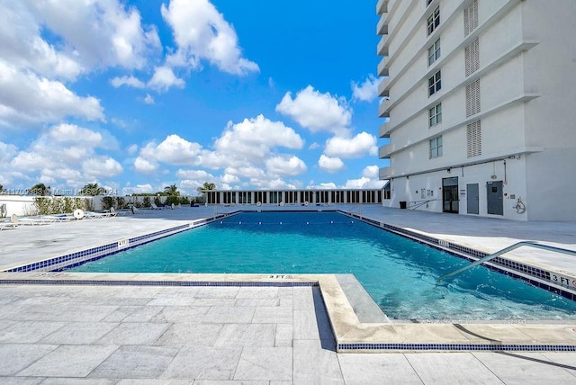 view of swimming pool featuring a patio area