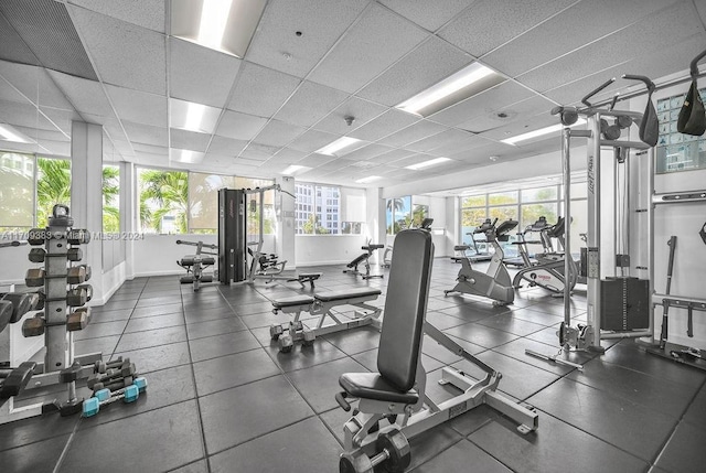 exercise room with a drop ceiling