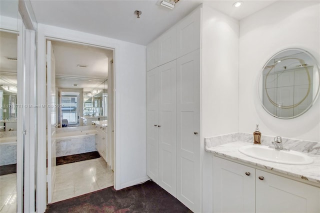 bathroom with tile patterned flooring and vanity