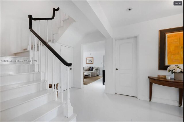 stairs with concrete floors