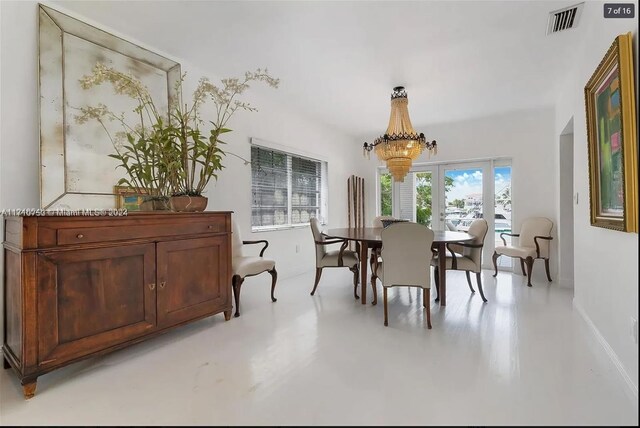 dining area featuring an inviting chandelier