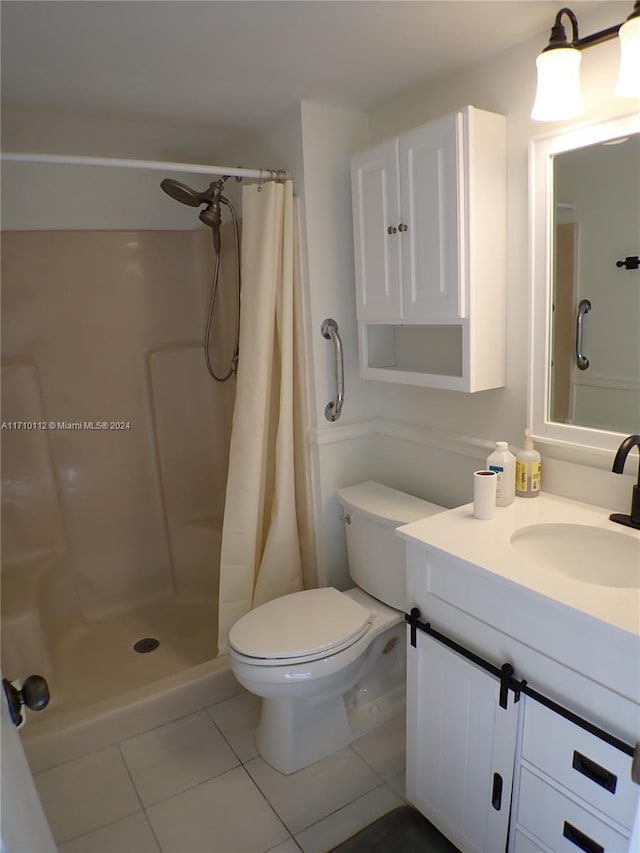 bathroom with tile patterned floors, vanity, toilet, and a shower with shower curtain