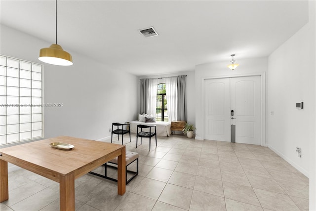 dining area with light tile patterned floors