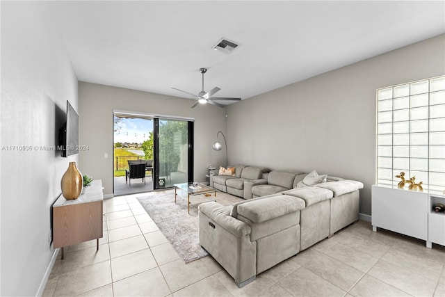 living room featuring ceiling fan and light tile patterned floors