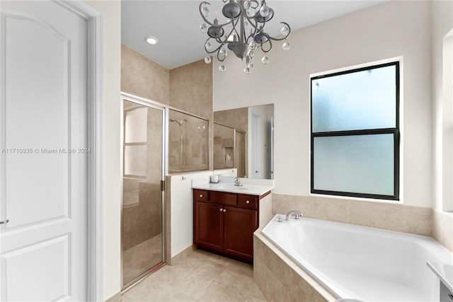 bathroom featuring tile patterned flooring, a notable chandelier, vanity, and independent shower and bath