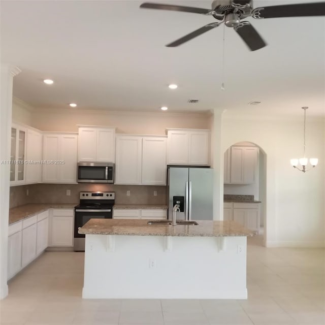 kitchen with white cabinetry, a center island with sink, and stainless steel appliances