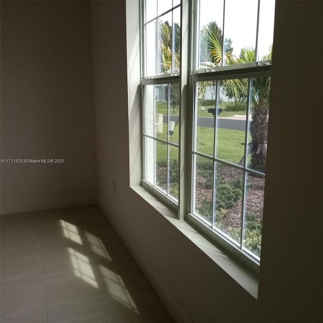 empty room with tile patterned flooring