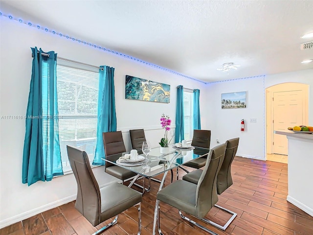 dining room with hardwood / wood-style flooring